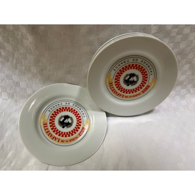 A charming set of 6 porcelain dessert or cheese plates. Each plate depicts General Lafayette in the center and the words,...