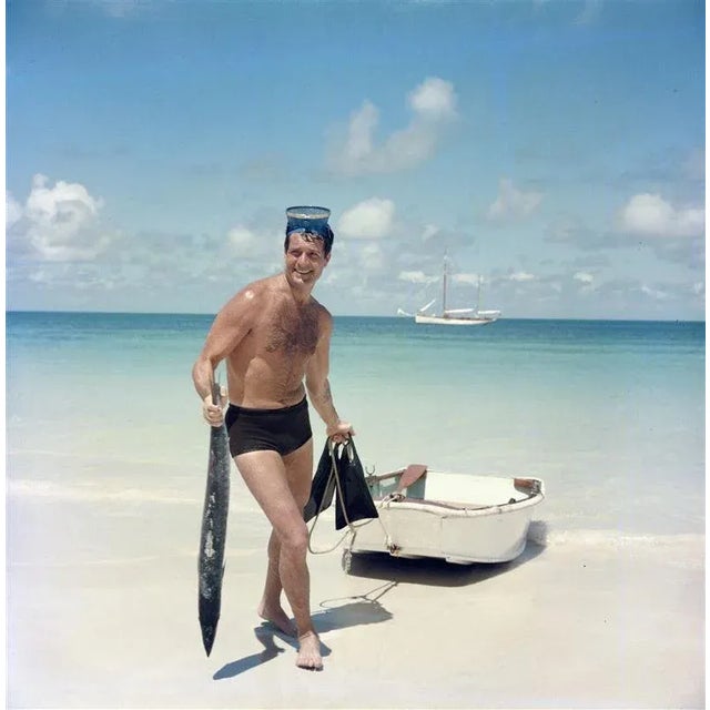 O’Brian’s Catch (1961) Limited Estate Stamped (Photo By Slim Aarons) American actor Hugh O’Brian returns to the beach with...