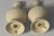 Classic Lenox ivory salt & pepper shakers with gold trim—timeless American elegance. A refined pair of vintage Lenox...