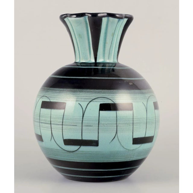Ilse Claesson for Rörstrand. Large Art Deco faience vase. Date: approx. 1940. Hand-painted with a geometric pattern....