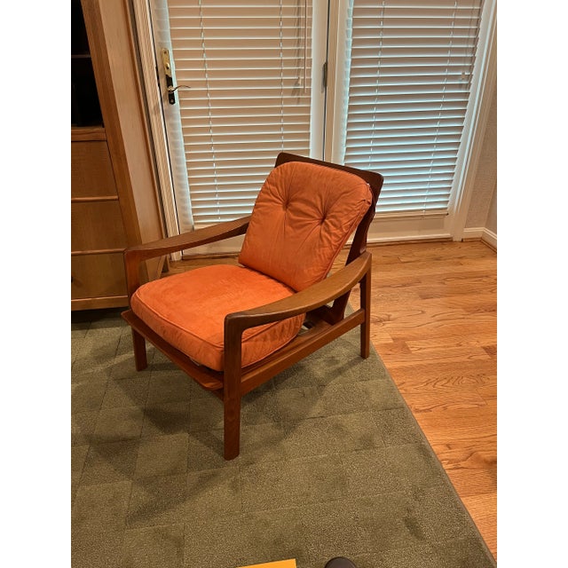 Teak lounge chair made in Norway. Cushions are for demonstration purchases only. Cushions are not included with chair....