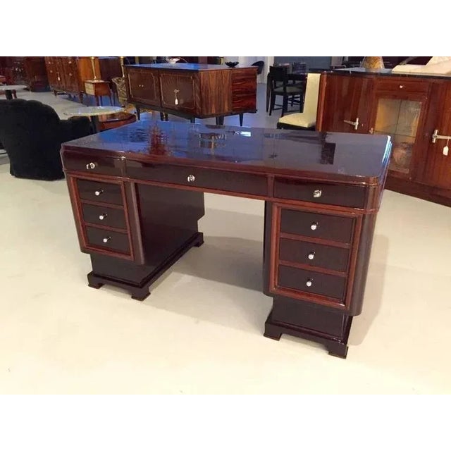 Gorgeous French Art Deco two-tone desk table. Having beautiful Deco lines and silver hardware. All the locks work making...