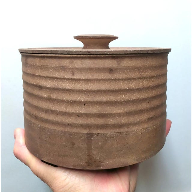 This piece, created by Nanni Valentini for Ceramica Arcore in the 1970s, is a container with a lid. It can hold various...