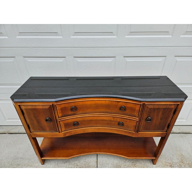 This gorgeous modern sideboard or cabinet clearly has an Arts and Crafts inspiration with bronze colored pulls and...