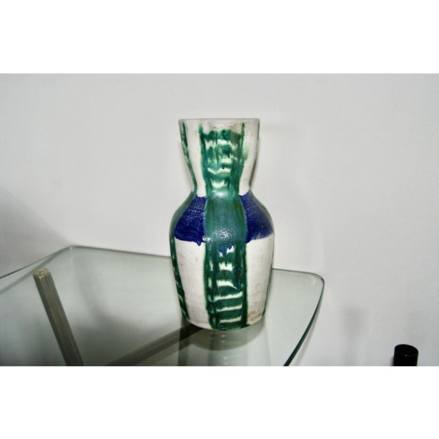 Ceramic pitcher with abstract decoration, signed with the workshop's logo, in good condition This piece has an attribution...