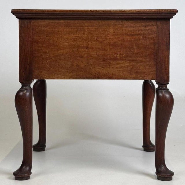 A charming and well-crafted early 20th-century English storage box, constructed in mahogany and combining useful concealed...