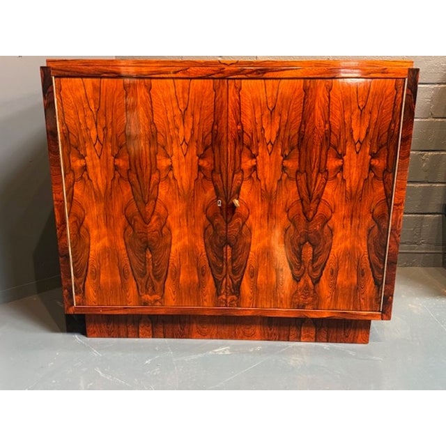 Experience the elegance of the French Art Deco era with this exquisite black walnut side cabinet. A beautiful addition to...