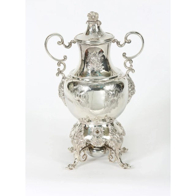 Early 20th century English silver plated footed hot water samovar with exterior design details / flame burner. The samovar...