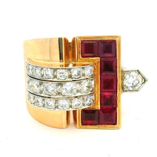Bold Retro-period tank-style ring crafted in solid 18K yellow gold, featuring a stepped architectural design set with...