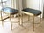 A sophisticated pair of vintage Italian tray tables featuring substantial verde marble trays set within elegant faux...