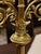 Representative pair of candlesticks in neo-Gothic style, made of brass with rich decorative decoration. Both candlesticks...