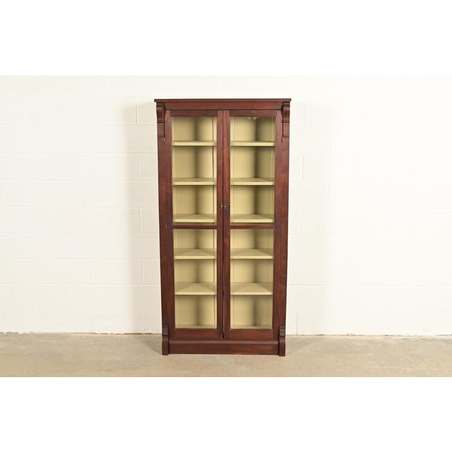A gorgeous antique American Empire or Victorian style bookcase cabinet In the manner of R.J. Horner & Co. USA, Circa 1900...