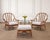 A beautifully crafted pair of bent pole rattan Organic Modern lounge chairs and matching ottoman made by artisans at...