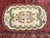 Small hooked rug made with rag wool woven on a burlap foundation. Dimensions: 3' x 4' 9' Date of Manufacture: Early 1900s...