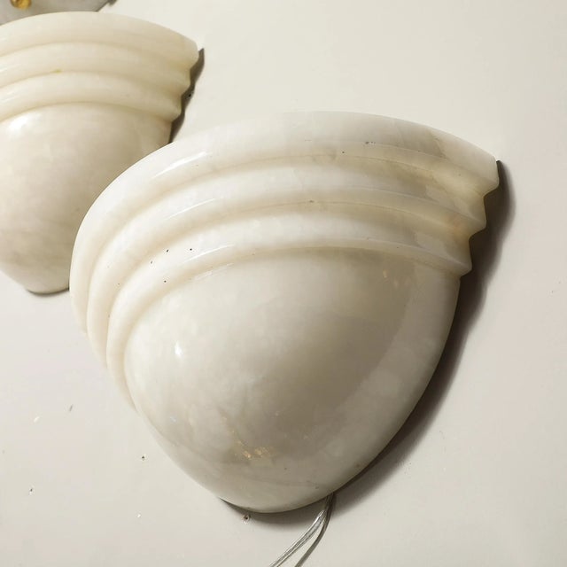 This elegant and beautifully formed Pair of Art Deco Skyscraper Style Alabaster Sconces originates from France during the...