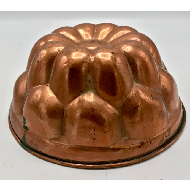 I love the look of antique copper jelly moulds on a kitchen wall. In fact it is a must in every classic French kitchen...