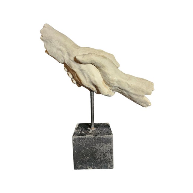 Celebrate the power of connection with this striking Vitruvian Shaking Hands Sculpture. Inspired by classical proportions...