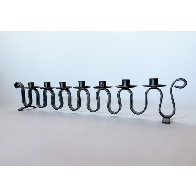 Fantastic squiggle iron candelabra. Marked Made in Sweden on the bottom, circa 1950s. Holds small 1/2" candles. Measures:...