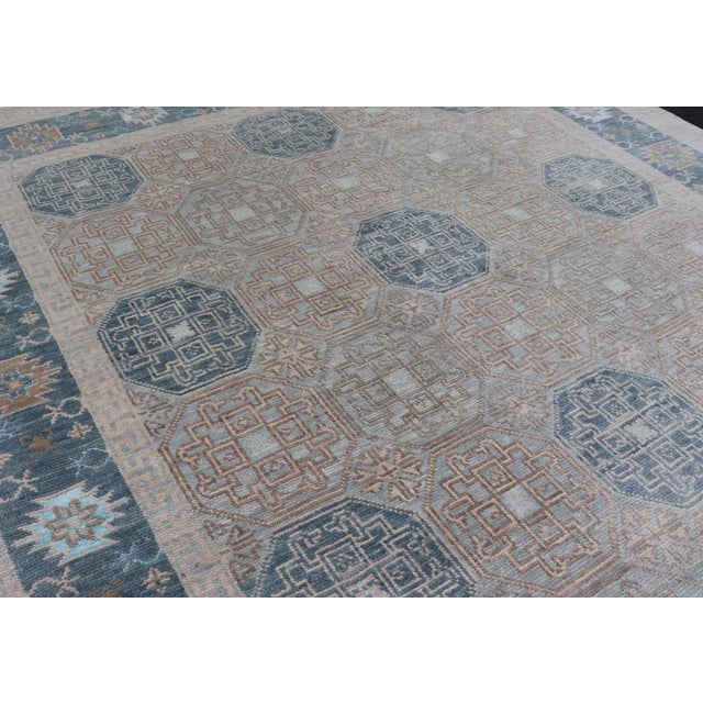 2020s Modern Hand Knotted Khotan in Wool With All-Over Medallion Design in Blue and Earthy Tones For Sale - Image 5 of 13