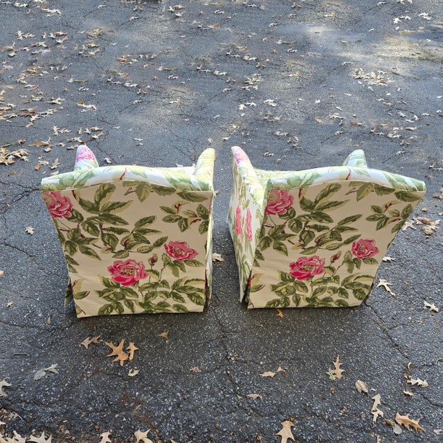 This pair of chairs is beautifully designed and ready to be displayed. It features a pink and green floral pattern to...