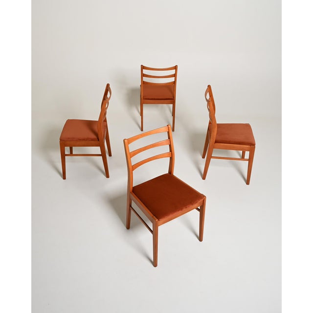 Teak dining chairs with a three-curved backrest and a padded seat upholstered in velvet. Set of 4. Scandinavian...