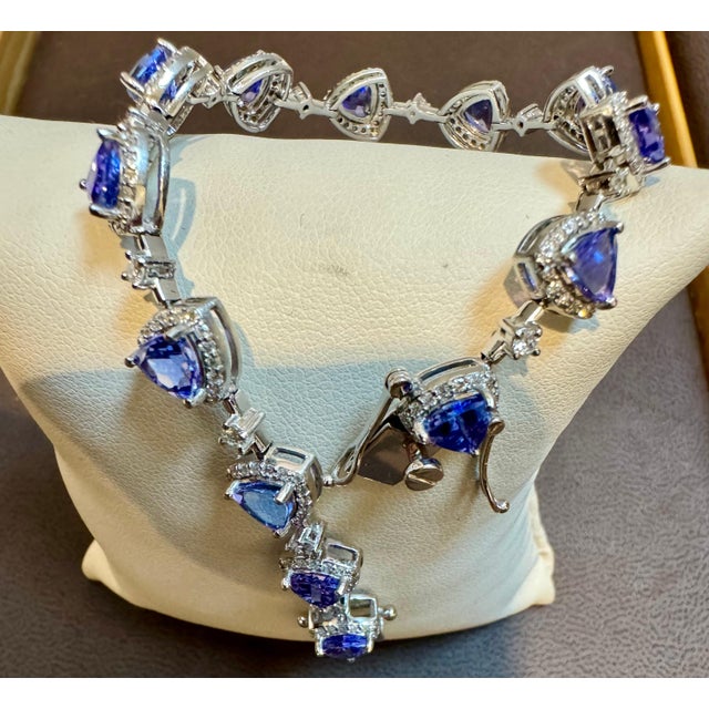 This exceptionally affordable Tennis bracelet has Multiple stones of Tanzanite in Trillion shape . Total weight of...