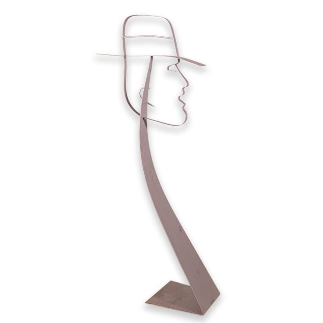 An Artisan House Curtis Jere male silhouette metal sculpture. A lovely table sculpture of a male head. The head looks to...