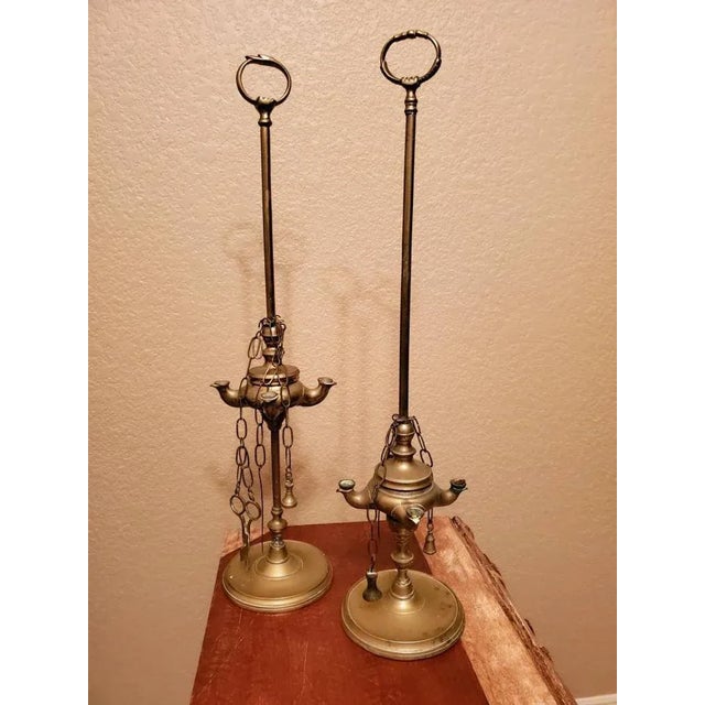 A lovely pair of elegant and interesting 19th-century brass Lucerna oil lamps from Italy. Commonly used throughout the...