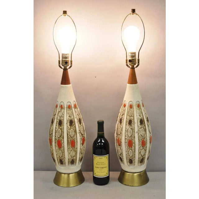 Vintage Mid Century Modern Ceramic Pottery Sculpted Teak Wood Table Lamps - a Pair. Circa Mid 20th Century. Measurements:...