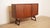 Beautiful 1960s Danish wall cabinet in warm teak designed by the renowned Clausen & Son in 1960s Denmark. This vintage...