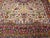 "A magnificent Persian Kerman Lavar room size rug circa the early 20th Century. This rug features a captivating all-over...