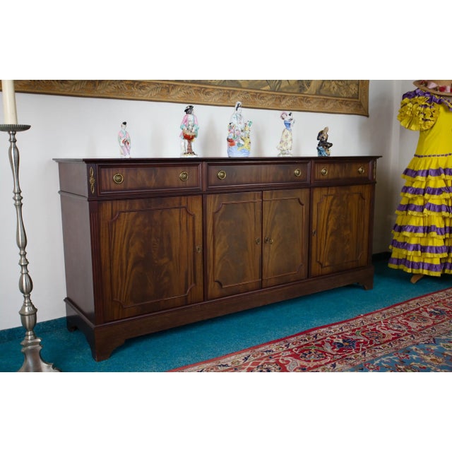 A large English chest of drawers made around 1980 in a traditional classicist style. The furniture stands out for its...