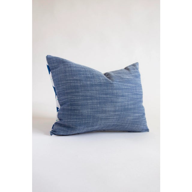 This small pillow is fun and funky with its diamond patterned front, and solid blue fabric back. It is just the thing to...
