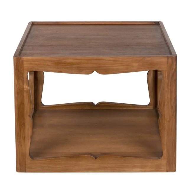Elevate your space with the Kabbal Side Table, a masterpiece of modern design and crafted from solid teak with a clear...