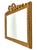 A beautiful mid century French carved giltwood rectangular mirror with beaded trim and a hand carved bow and ribbon in a...