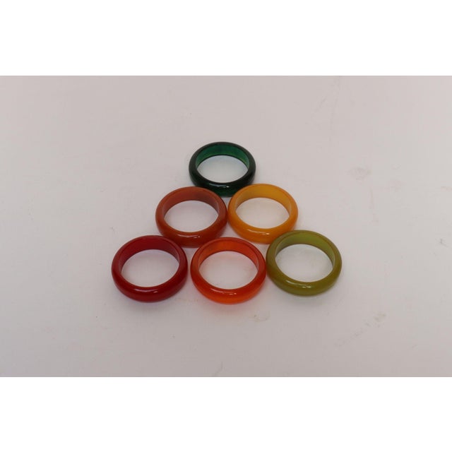 Complete set of six vintage bakelite napkin rings (ca. 1930s, USA). Attractive combination of colors - lime, emerald...