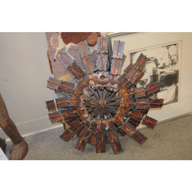 This is a heavy metal & iron piece. Cannot find a signature. Very Jere style. Back hanging circle.
