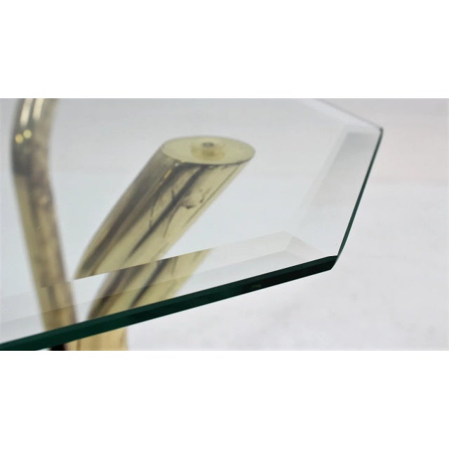 Vintage Italian design side table 1970s. Structure is made by cut glass top, 4 brassed uprights and colored glass base....