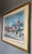 David W. Clough signed Lithograph “Sunny Caribbee Market” matted and framed in a gold toned wood frame beneath glass wired...