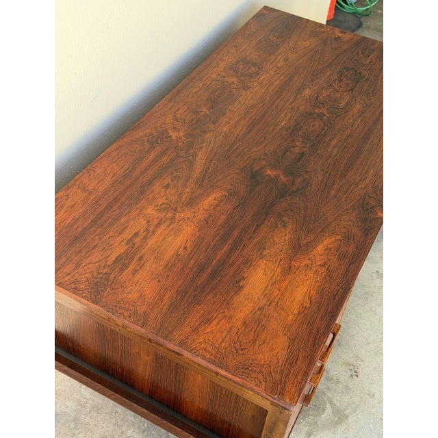 Stunning Mid-Century Danish modern desk designed in style of Kai Kristiansen, crafted in richly figured rosewood in...