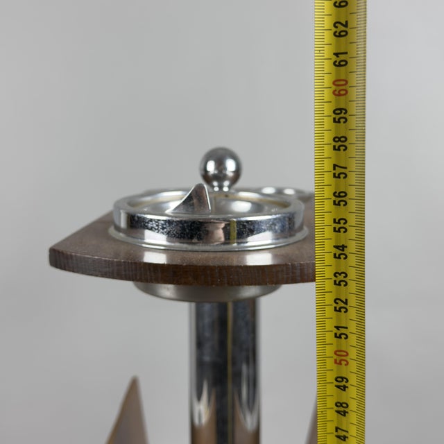 Rare and striking multifunctional floor-standing piece with an integrated ashtray and magazine rack, an authentic piece of...