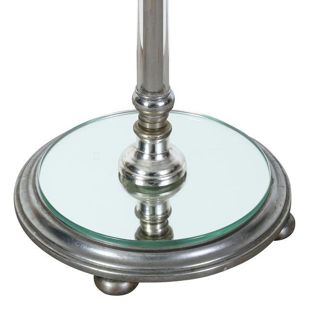 A vintage Hansen floor lamp features clean lines and classic materials. Crafted with a slender chrome column and a...