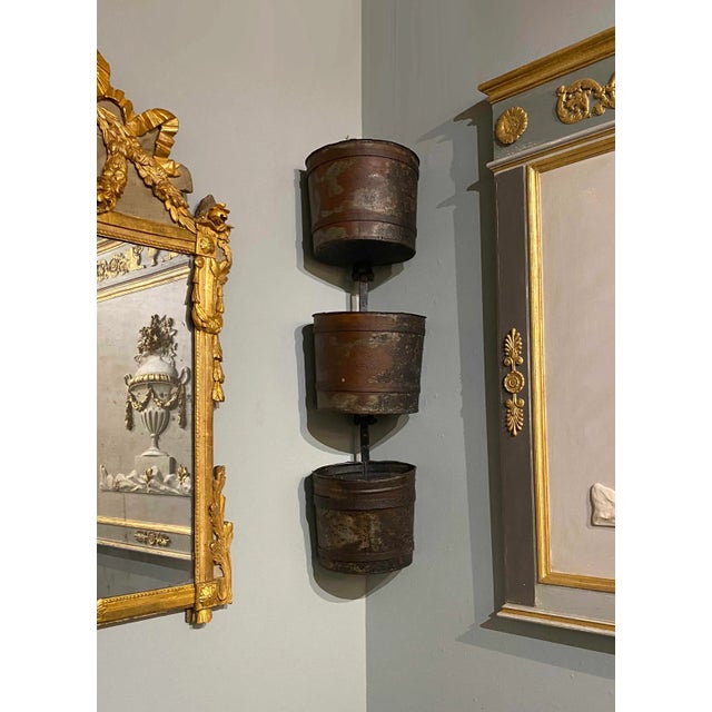 A set of three “Noria” buckets from a French water mill. Use as a stand alone decorative wall element or fill with plants.