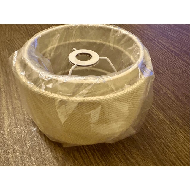 New Add a touch of rustic charm and natural texture to your home décor with this beautiful burlap lampshade. The neutral...