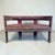 A striking two‑seater settee, likely mid to later 20th century, in the african tribal style. Hardwood, carved and banded...