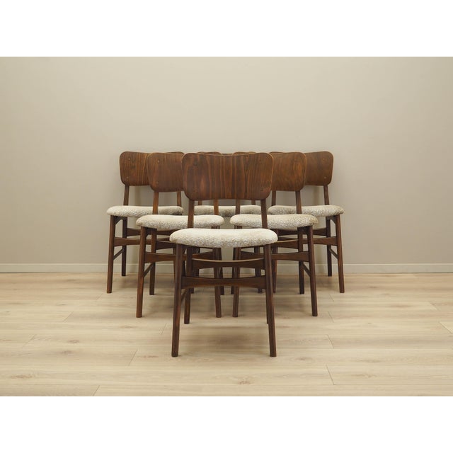 Set of six chairs made in the 1960s, Danish production. The backrests are covered with walnut veneer, and the frame and...