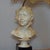 This lamp makes use of a bust by the sculptor Santi. It is a signed recast of his work and makes this mid century modern...