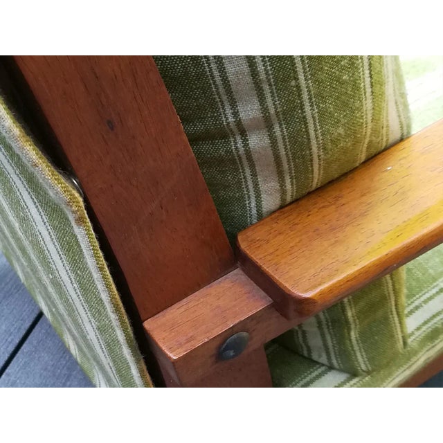 Pair of 50s teak armchairs very nice quality. The sleek and angular line evokes of course the French functionalist design...