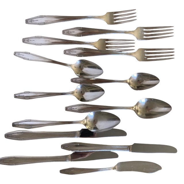 1920s Oneida Silver Plate Flatware: 13 Pieces of Countess I That Includes: Grille Forks, Knives, Teaspoons, Tablespoons, and Butter Knife. For Sale