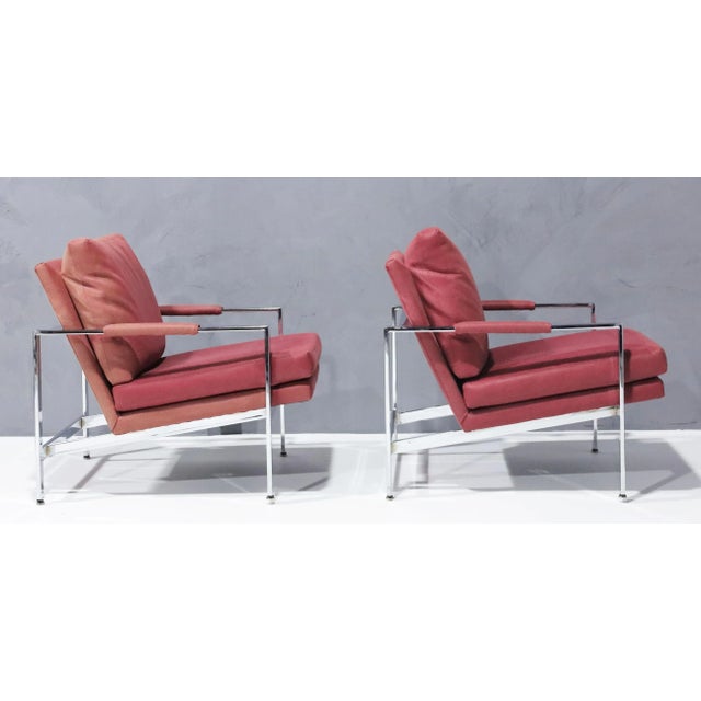 Elevate your living space with one of Milo Baughman's timeless designs, a pair of chrome frame lounge chairs in a dusty...